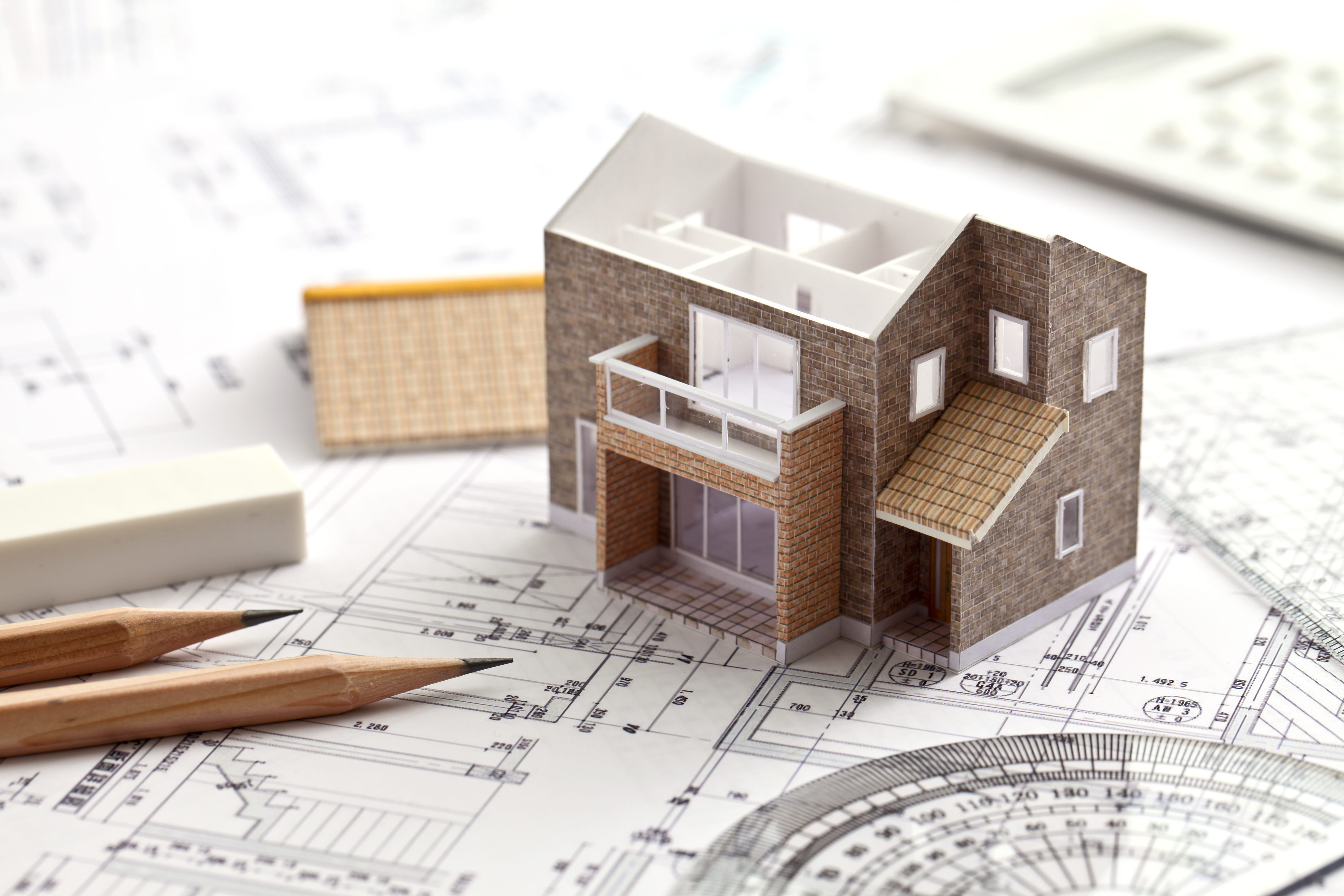 Model house on mathematical paper showing scale