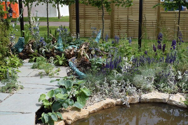 wildflower garden and shrubery on Bradstone paving area
